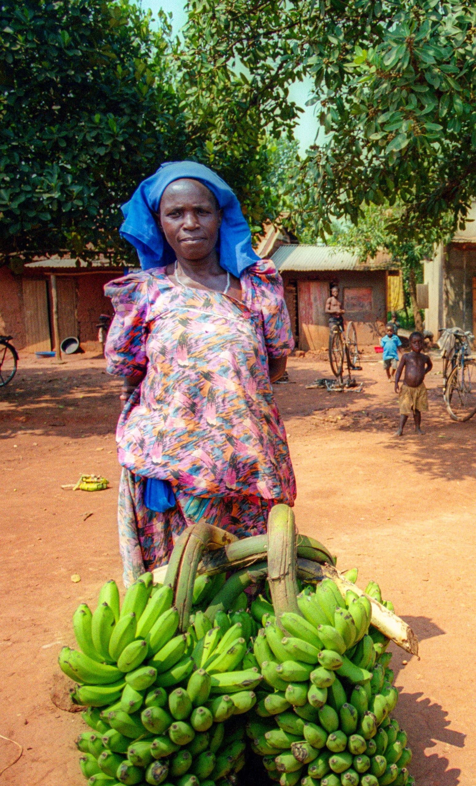 lady with two bunches matooke scaled